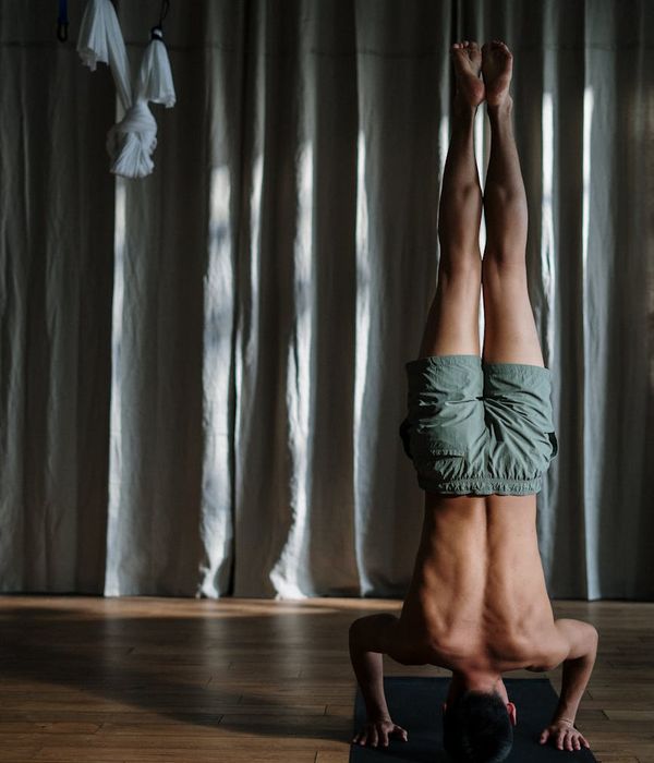 Man performing a core strength exercise with concentration.
